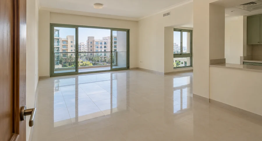 Spotless empty apartment living room with polished tiled floors after professional move-out cleaning service
